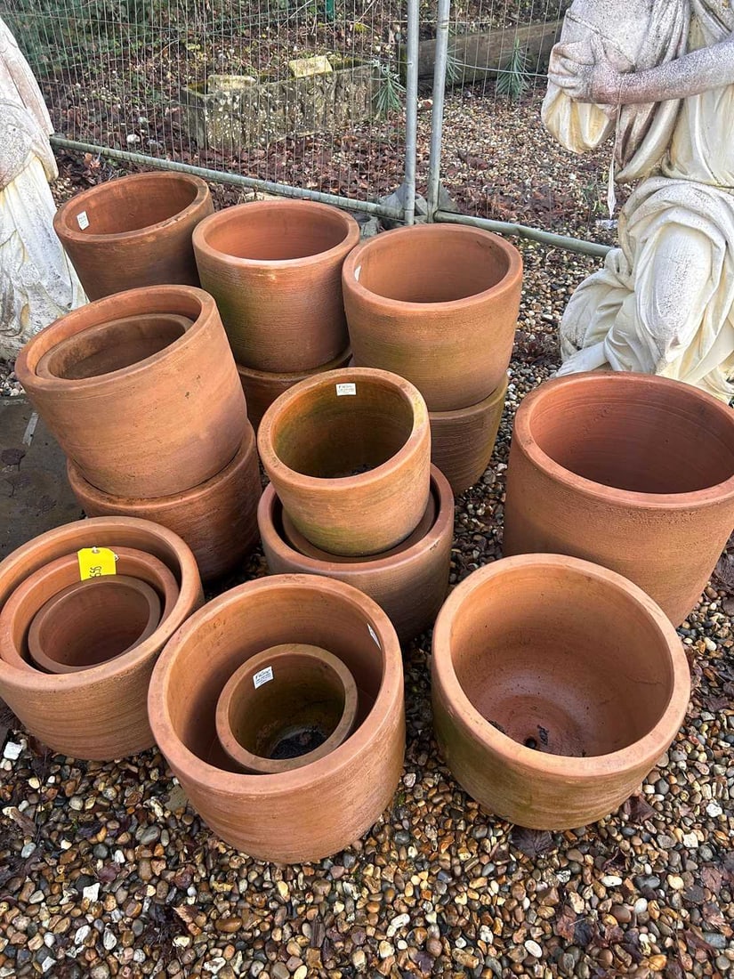 A large collection of terracotta pots, 21st century,: A large collection of terracotta pots, 21st century, with a grooved banded design to the exterior qty
