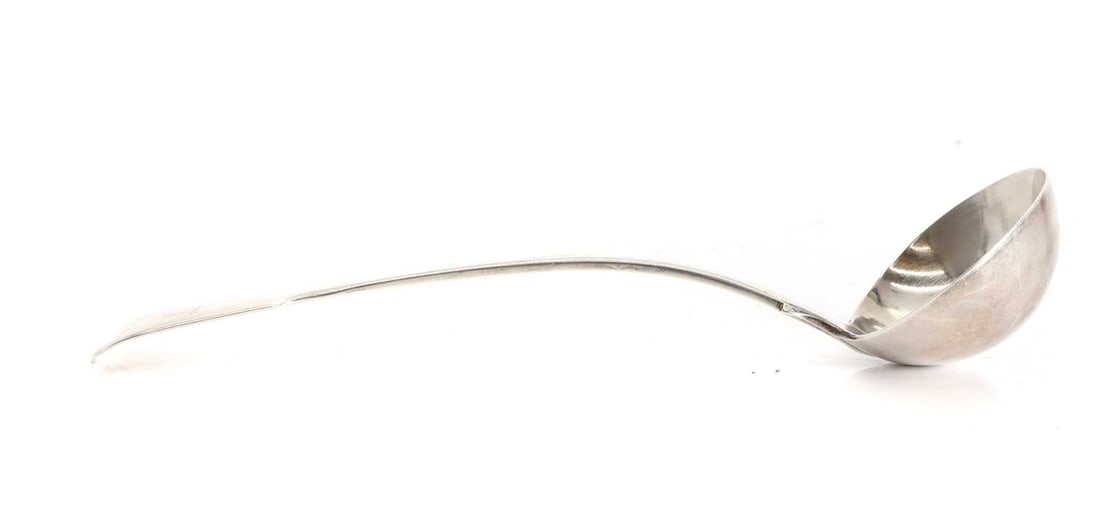 A Victorian silver fiddle-pattern soup ladle, 19th century,: A Victorian silver fiddle-pattern soup ladle, 19th century, marked 'RC', London 1846, with lion crest to the handle 33cm long; 9ozt