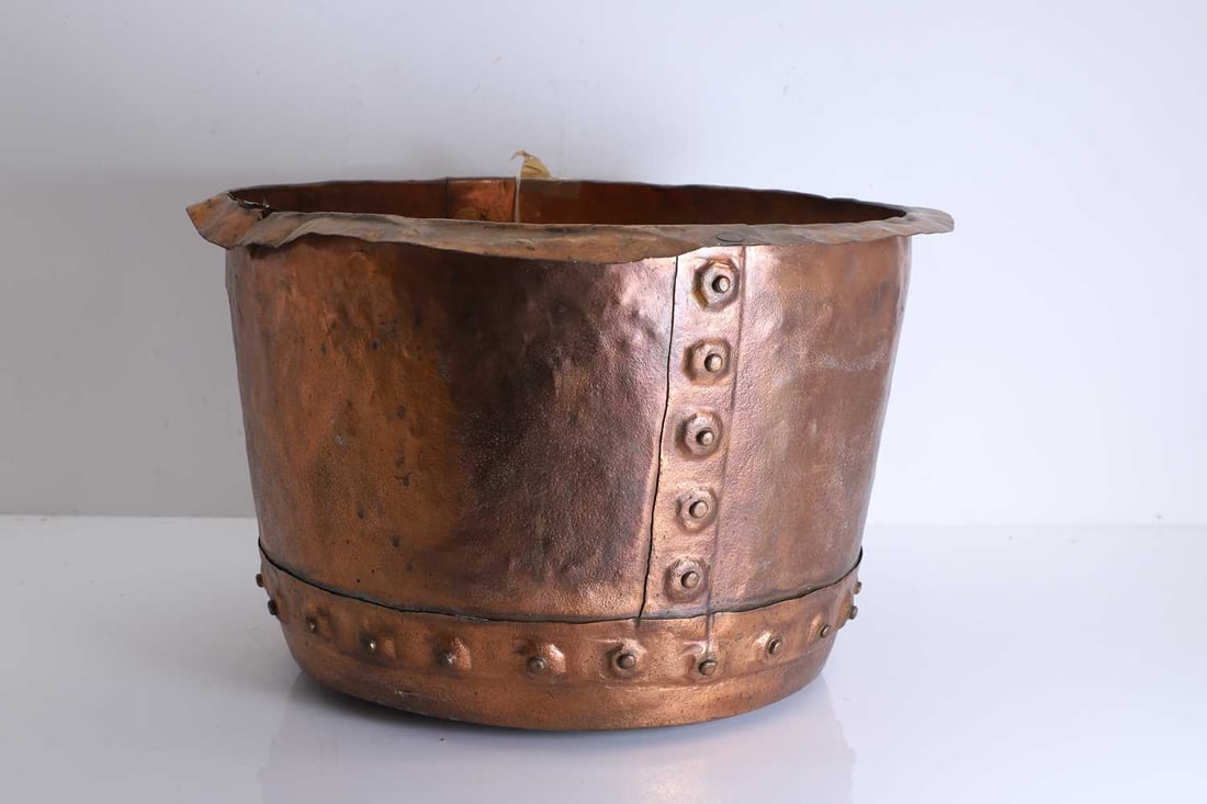 A copper copper, 19th century,: A copper copper, 19th century, riveted construction and spot hammered rim 49cm wide, 33cm high