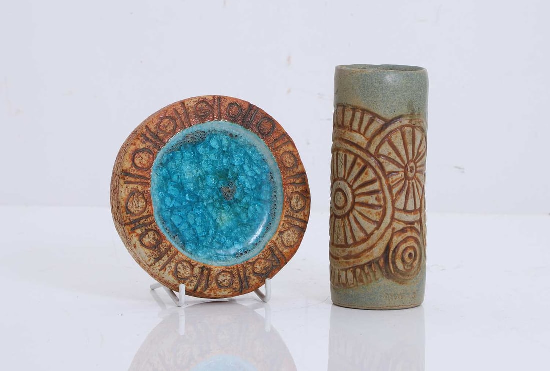 Two Bernard Rooke ceramics,: Two Bernard Rooke ceramics, to include a stoneware cylindrical vase with wheel design, circa 1970, stamped 'ROOKE' to the base, together with a circular stoneware and glass plaque, the centre