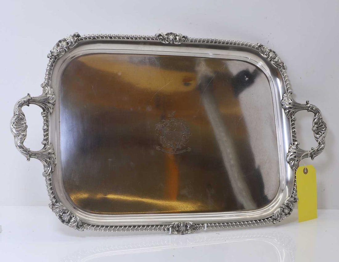 A Sheffield-plated salver, 19th century,: A Sheffield-plated salver, 19th century, of rectangular form with a gadrooned border, and twin handles, centred with an engraved crest of the Hamiltons of Raploch, with the motto 'Qualis Ar