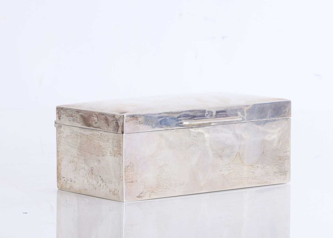 A silver cigarette box, 20th century,: A silver cigarette box, 20th century, by S Blanckensee & Son Ltd, Birmingham 1938, with personal inscription 'Jimmy... 1939' lined in wood 16cm wide, 8.5cm deep, 6cm high; total 15.7ozt