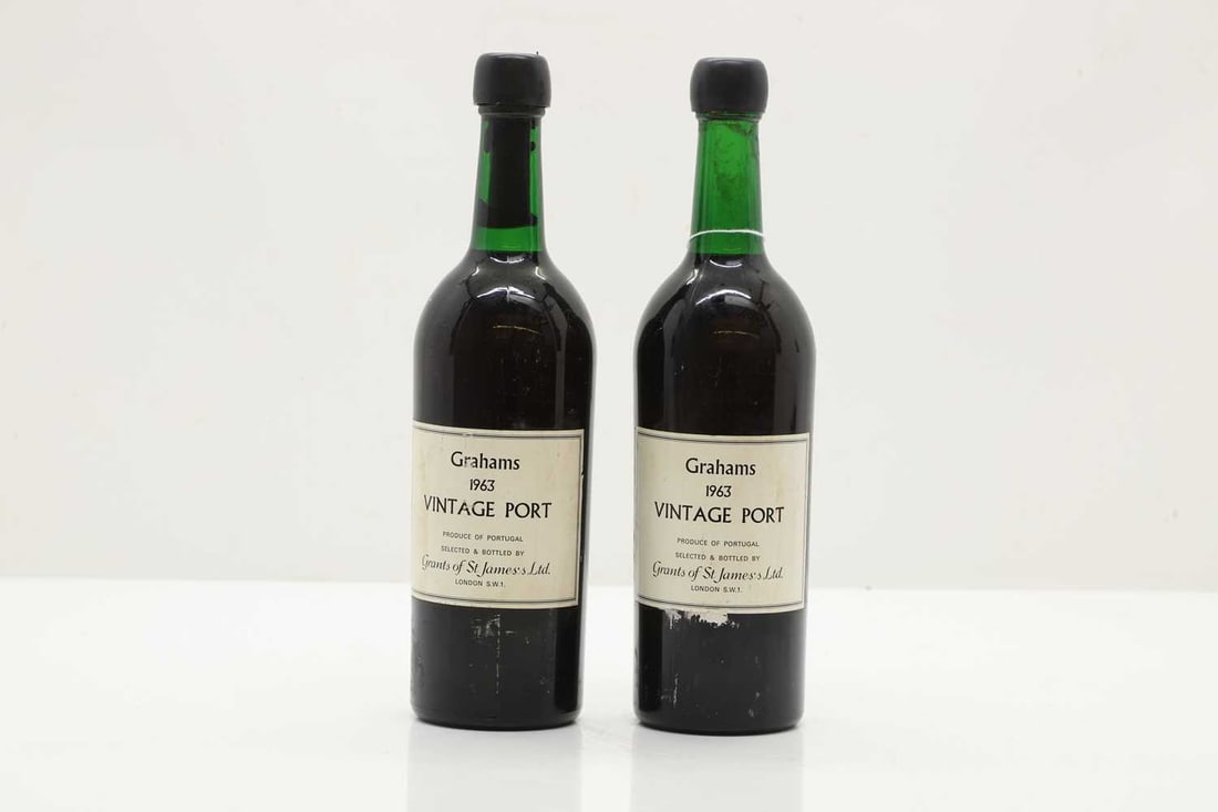 Grahams, Vintage Port, 1963: Grahams, Vintage Port, 1963 (1) together with Grahams, Vintage Port, 1963 (1) the bottle is labelled as 'Grahams 1963' but capsule reads 'Sandeman 1963'. SInce arriving with us, from temperature