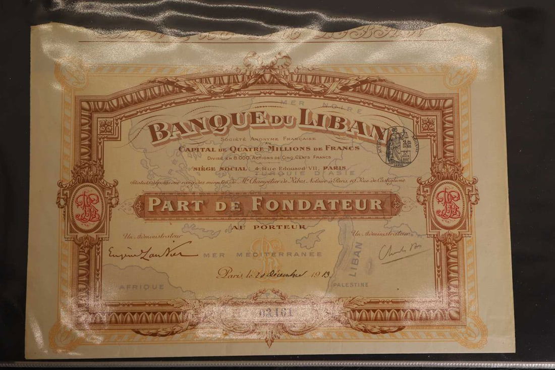 A collection of share certificates, - 2