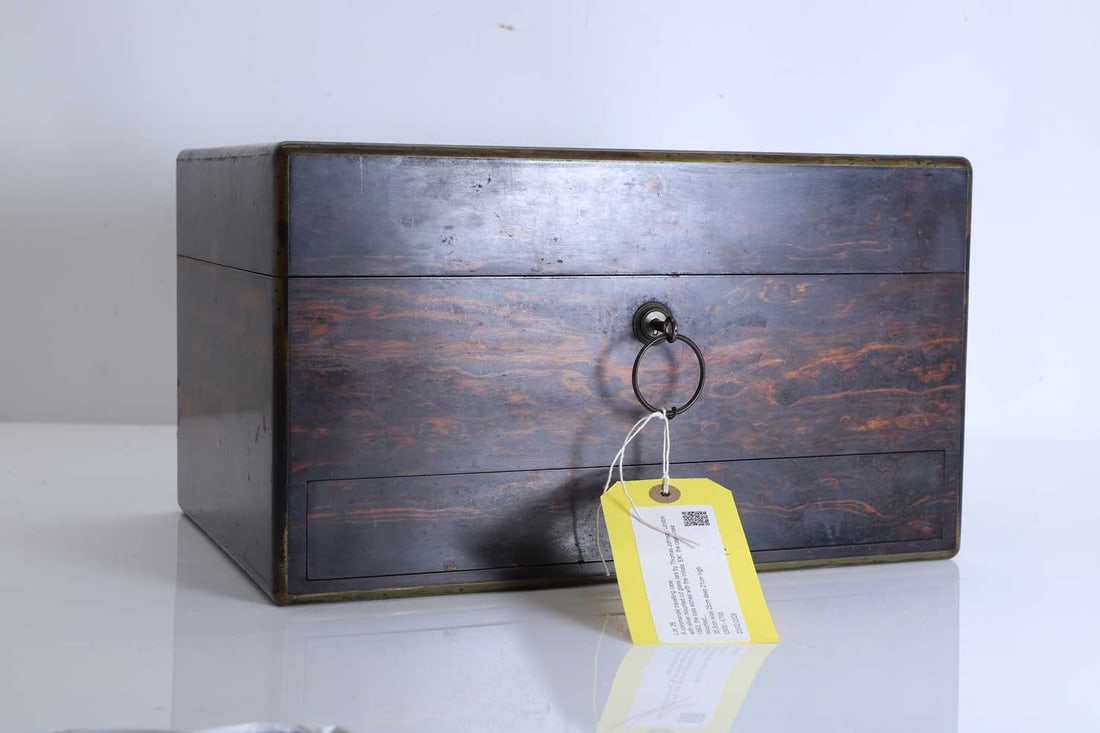 A coromandel travelling case,: A coromandel travelling case, with silver mounted cut glass jars by Thomas Johnson, London, 1863, the tops etched with the initials 'EK', the case brass mounted with a lift top above one drawer 35.5c