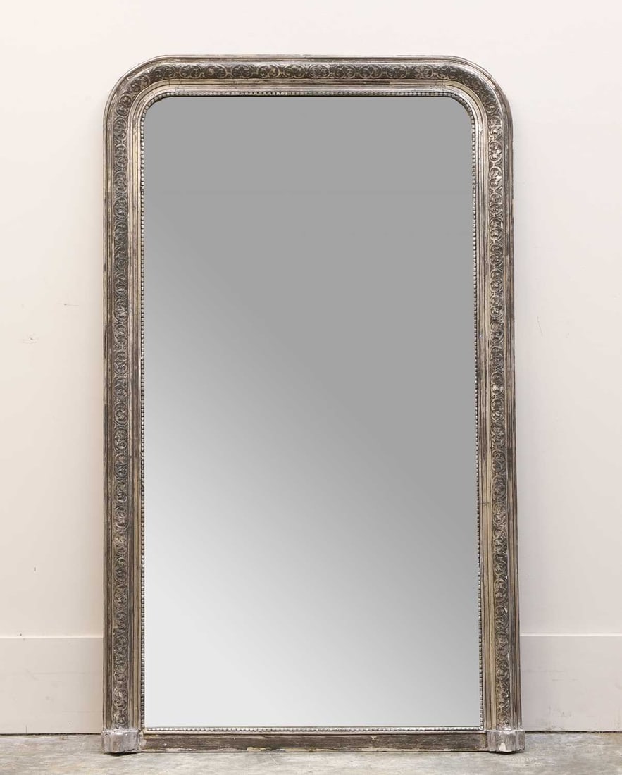 A silvered wall mirror, Of modern manufacture,: A silvered wall mirror, Of modern manufacture, with a plain plate, with an arch pediment 87cm wide, 147cm high