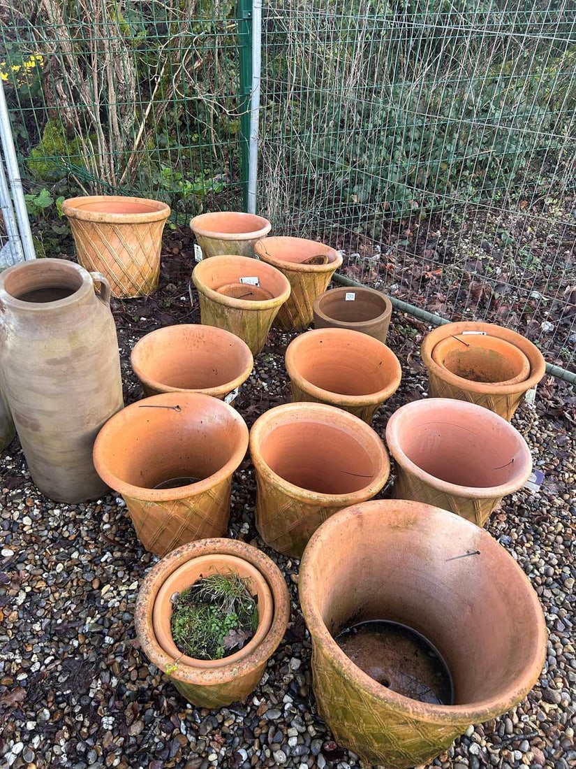 A large collection of terracotta pots, 21st century,: A large collection of terracotta pots, 21st century, decorated with low relief studded cross banding The largest, 48cm diameter qty.
