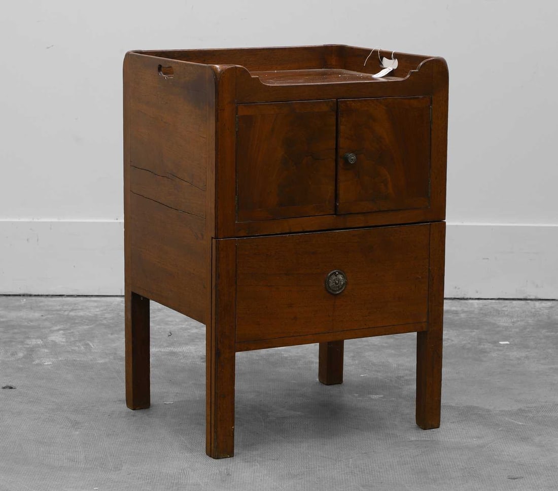 A George III mahogany tray top commode, Late 18th century,: A George III mahogany tray top commode, Late 18th century, the traytop with cupboard doors below and brass embossed handles 53cm wide, 45cm deep, 77cm high