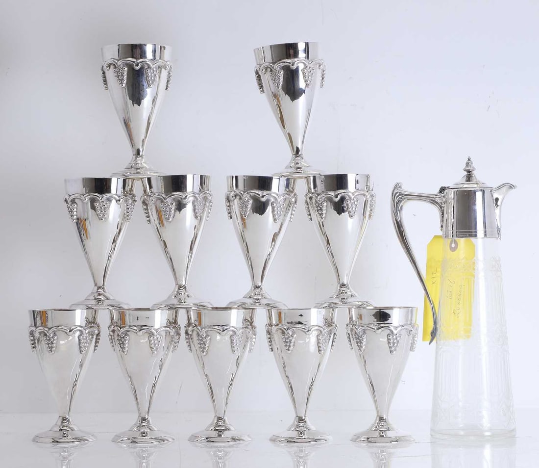 A set of French silver-plated wine goblets, Of modern manufacture,: A set of French silver-plated wine goblets, Of modern manufacture, stamped marks 'ST SIS France II and L'Ecuyer', and a cut glass and silver-plated claret jug 14.5cm, claret jug, 31cm high 11 
