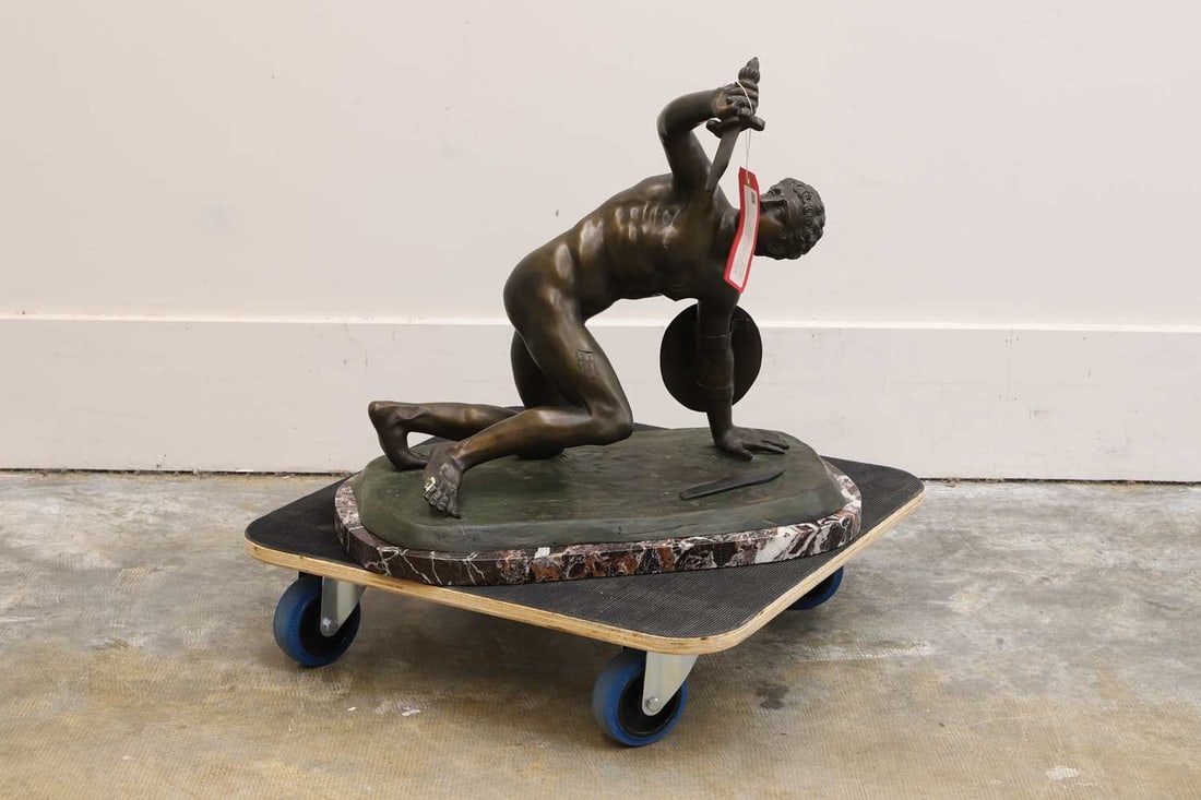 After the antique, Of modern manufacture,: After the antique, Of modern manufacture, in the style of 'The Borghese Gladiator', a bronzed figure, raised on a marble plinth 57.5cm wide, 35cm deep, 52.5cm high Condition Report: Modern,