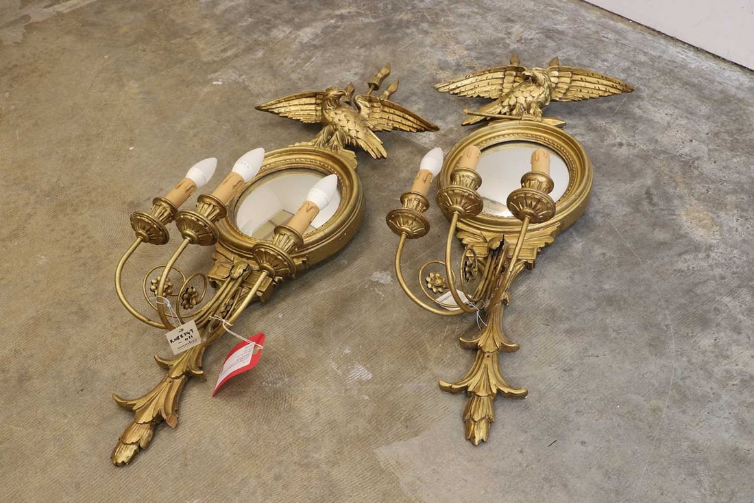 A pair of Regency style girandoles, 20th century,: A pair of Regency style girandoles, 20th century, each with eagle support, convex mirrors, and three lights converted to electricity 38cm wide, 95cm wide 2 Condition Report: Dry cracking to the