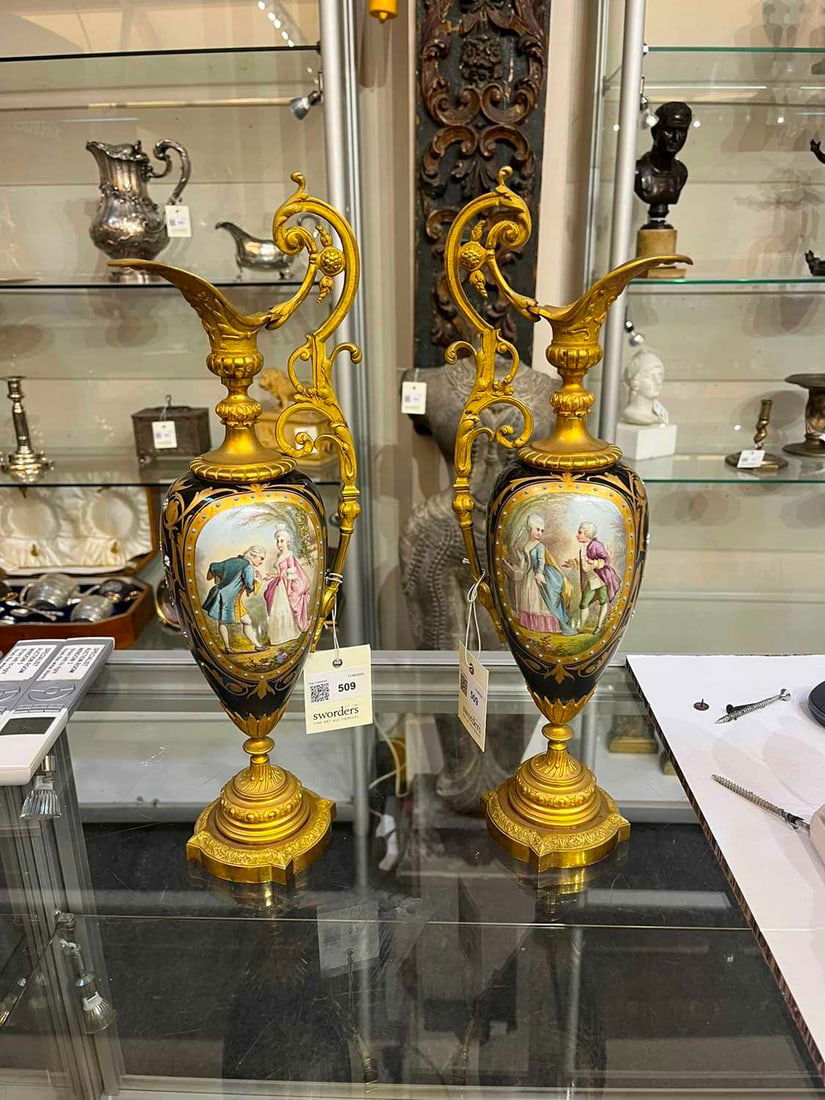 A pair of ormolu-mounted porcelain ewers, 19th century, - 10