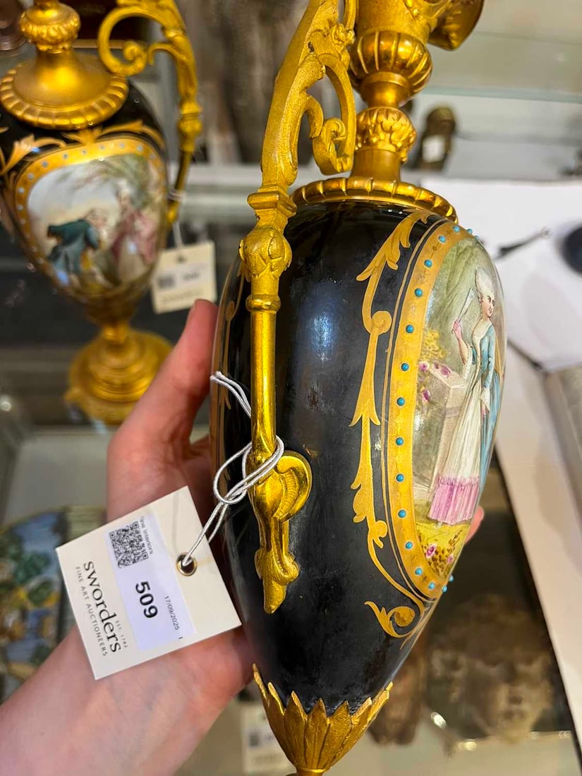 A pair of ormolu-mounted porcelain ewers, 19th century, - 11