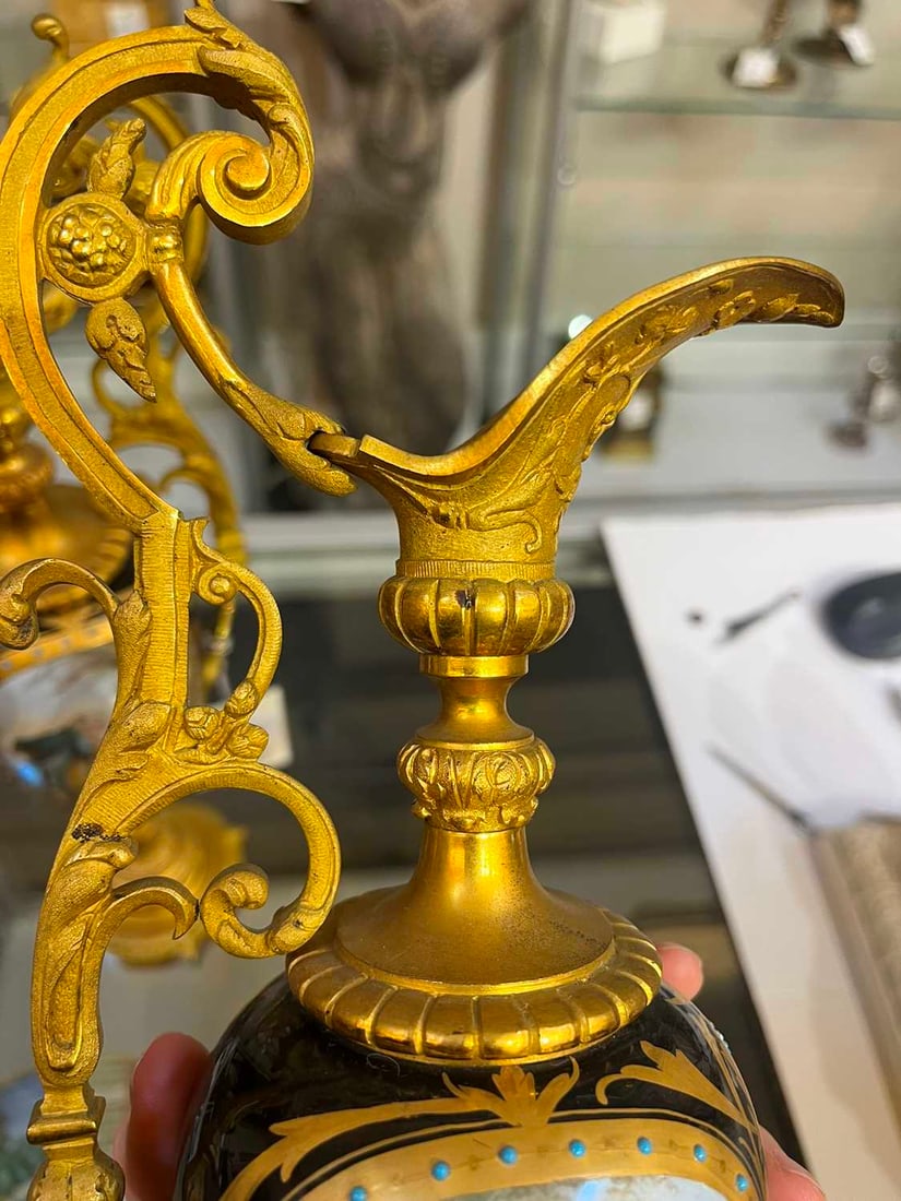 A pair of ormolu-mounted porcelain ewers, 19th century, - 14