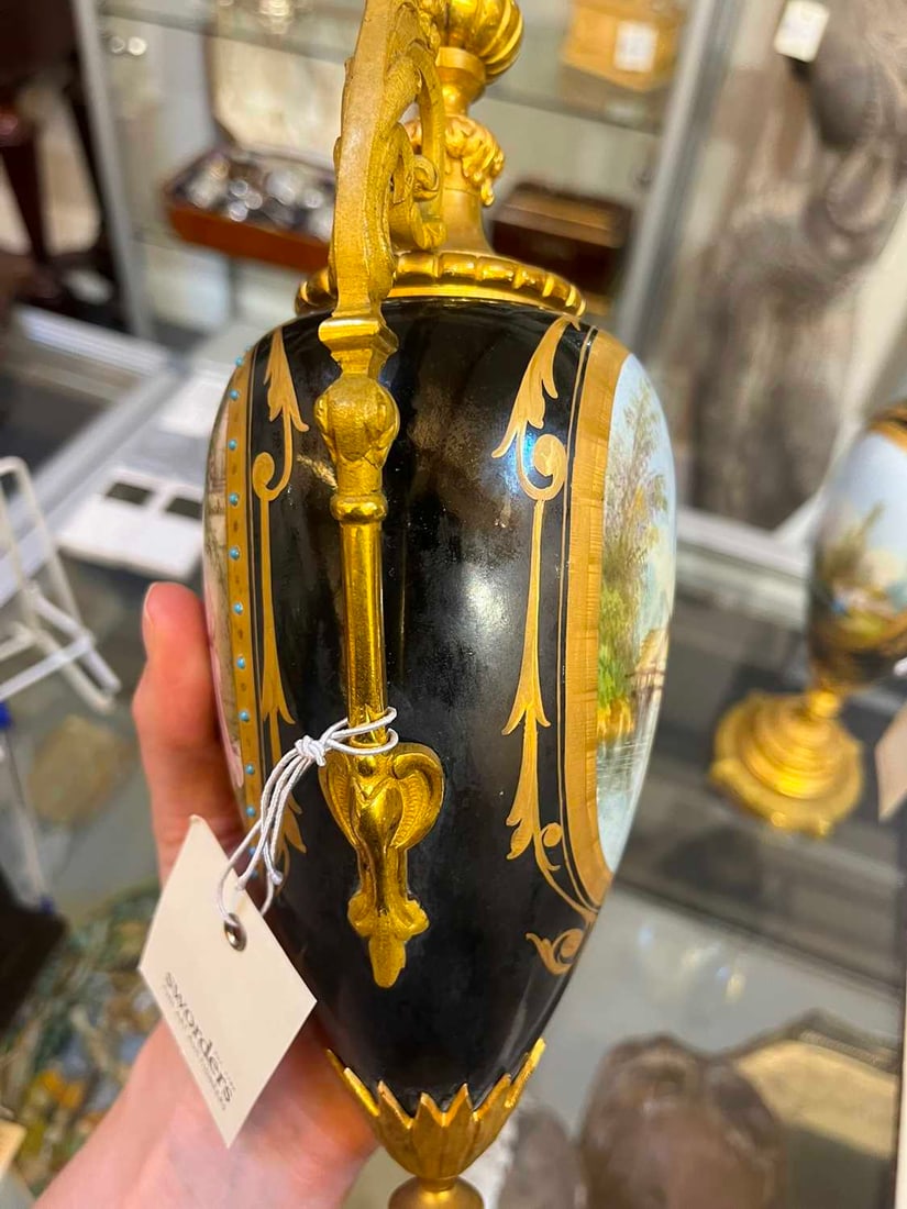 A pair of ormolu-mounted porcelain ewers, 19th century, - 15