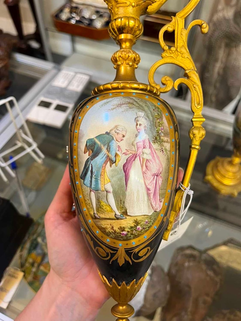 A pair of ormolu-mounted porcelain ewers, 19th century, - 17