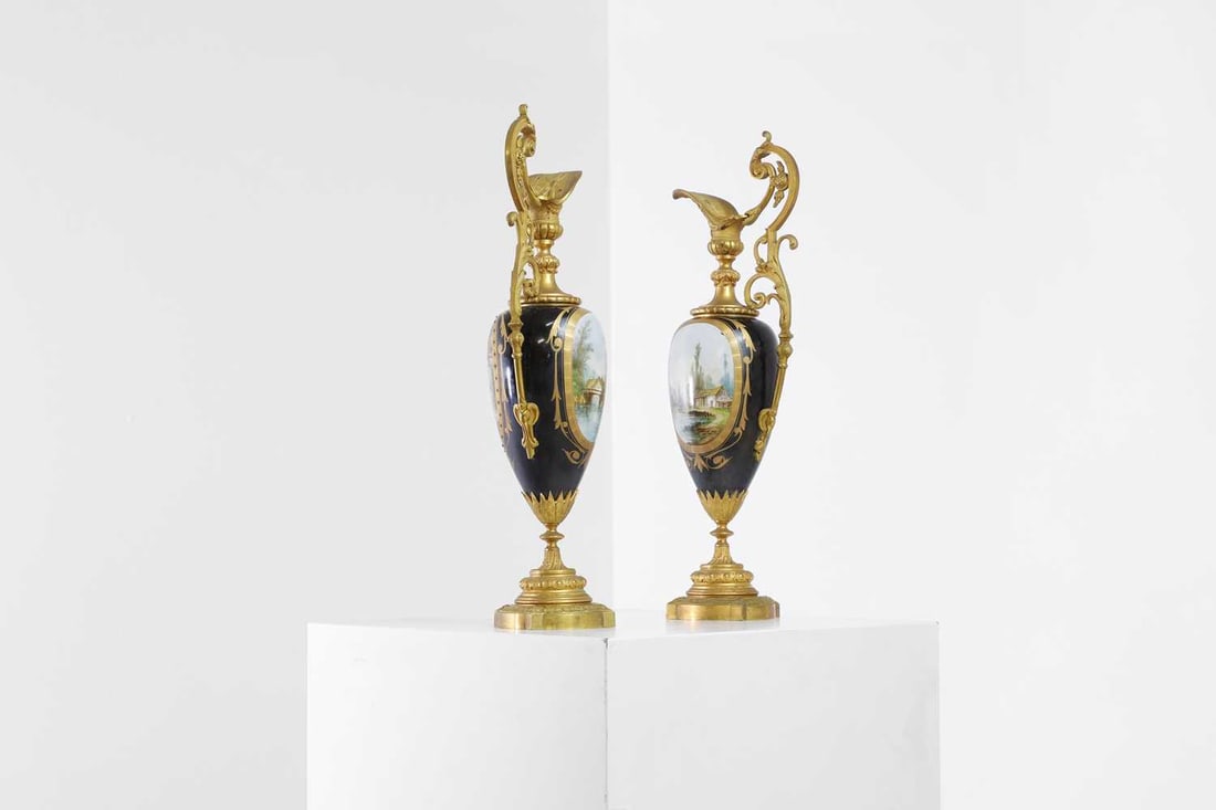 A pair of ormolu-mounted porcelain ewers, 19th century, - 18