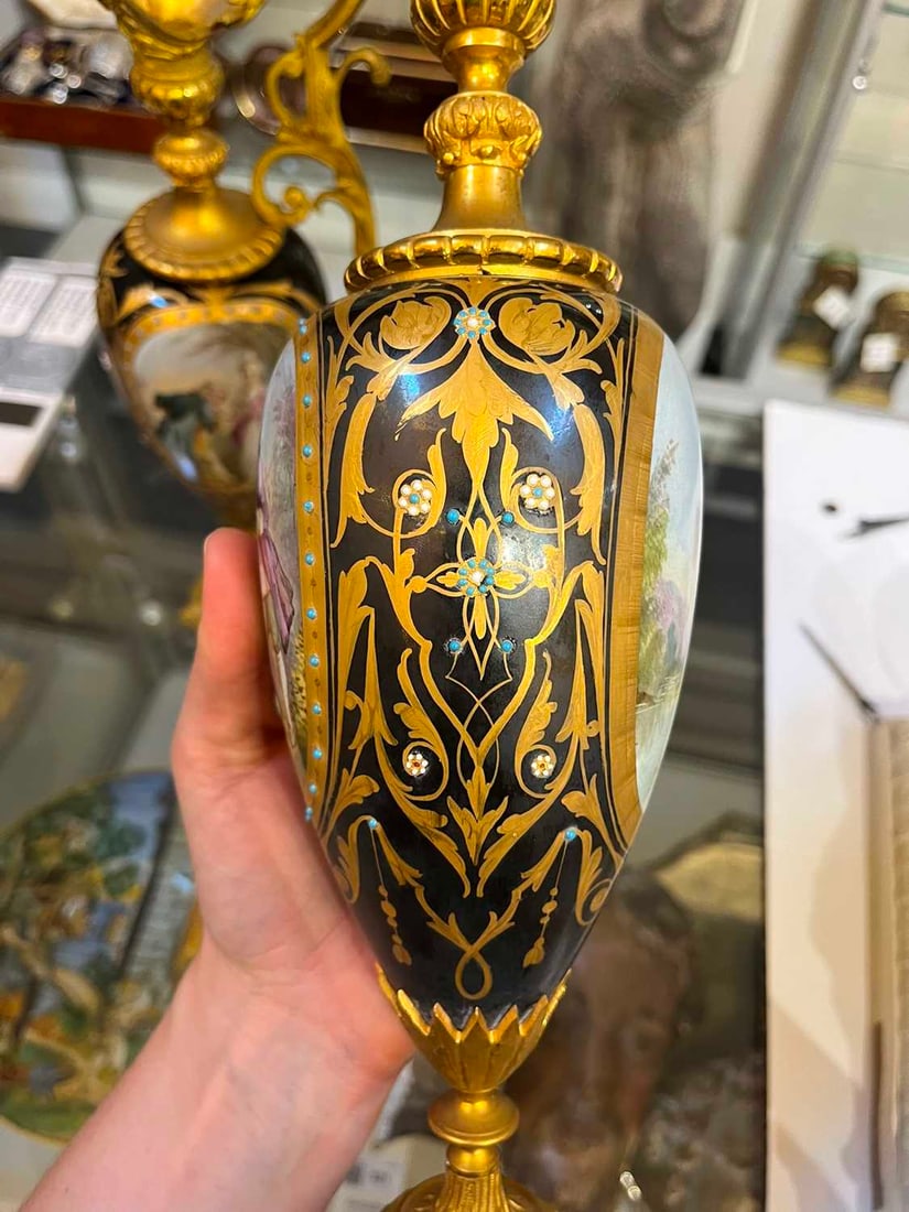 A pair of ormolu-mounted porcelain ewers, 19th century, - 19