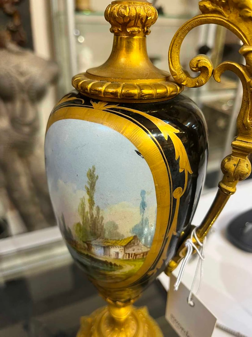 A pair of ormolu-mounted porcelain ewers, 19th century, - 20