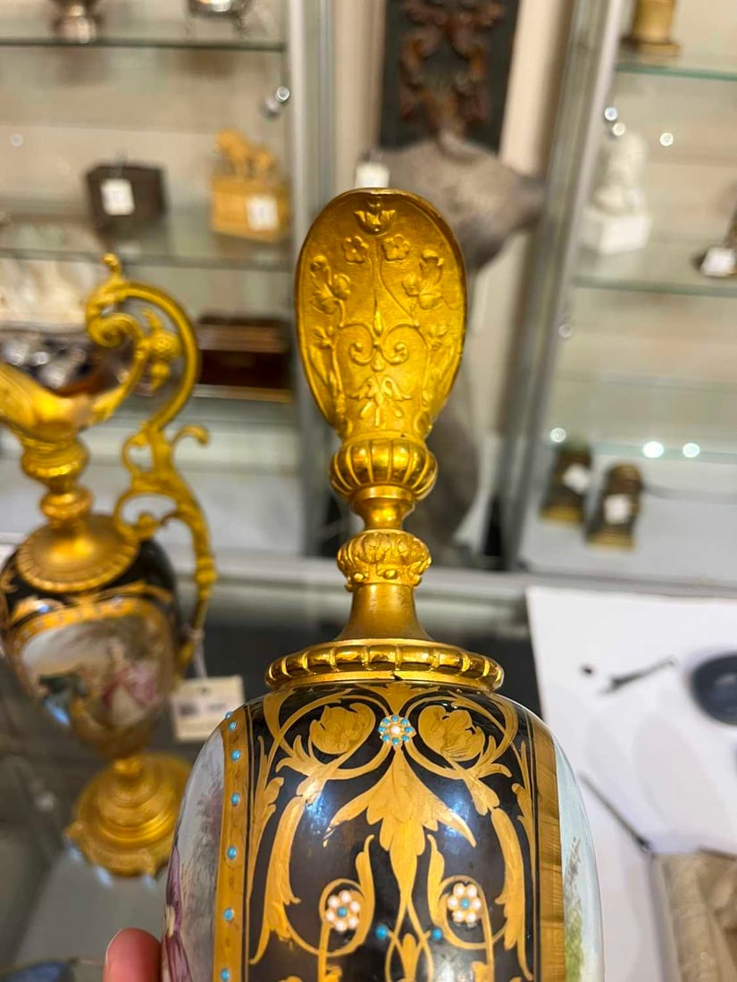 A pair of ormolu-mounted porcelain ewers, 19th century, - 4