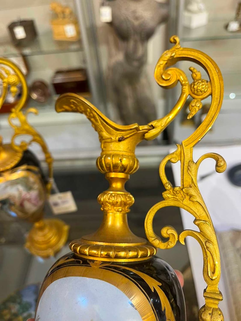 A pair of ormolu-mounted porcelain ewers, 19th century, - 6