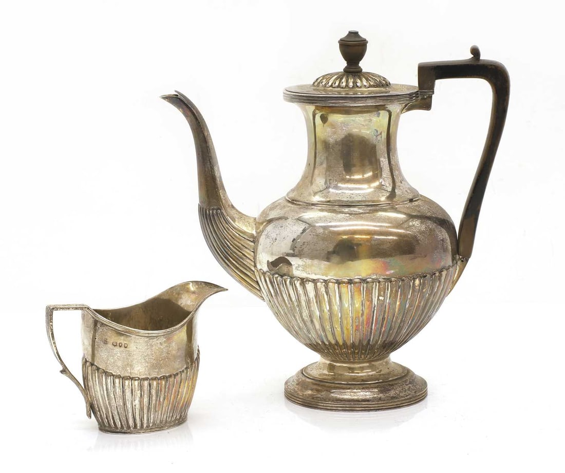 A Victorian silver coffee pot and creamer, (1 of 4)