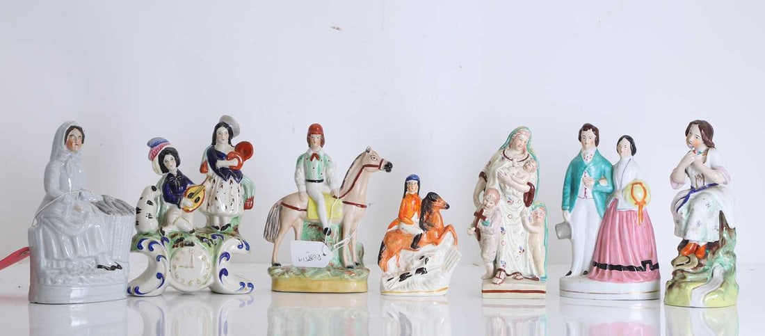 A collection of Staffordshire flatbacks, 19th century and later,: A collection of Staffordshire flatbacks, 19th century and later, to include a fisherwoman, a couple promenading, two gentlemen mounted on horses, a pearlware figure of 'Charity', a figure group of