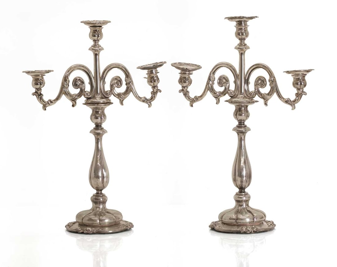 A pair of Dutch .833 standard silver three-light candelabra, (1 of 4)