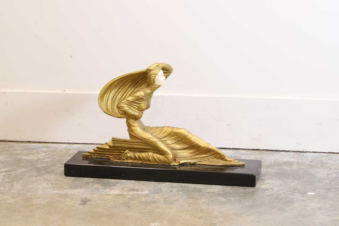 After Demetre Chiparus (Romanian/French, 1886-1947), An Art Deco Bronze and ivory figure,: After Demetre Chiparus (Romanian/French, 1886-1947), An Art Deco Bronze and ivory figure, depicting a seated lady reclined on a black marble base, Ivory Declaration Submission Reference: