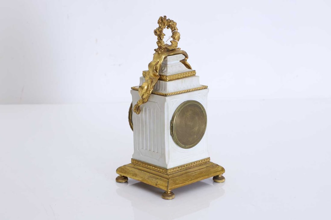 A French bisque and gilt clock, 20th century, - 2