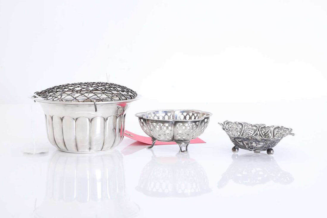 A group of silver items: A group of silver items comprising a rose bowl, by Parkin Silversmiths Ltd, Sheffield 1982, together with a bonbon dish with chased and repousse decoration, and one other bon bon dish with pierced