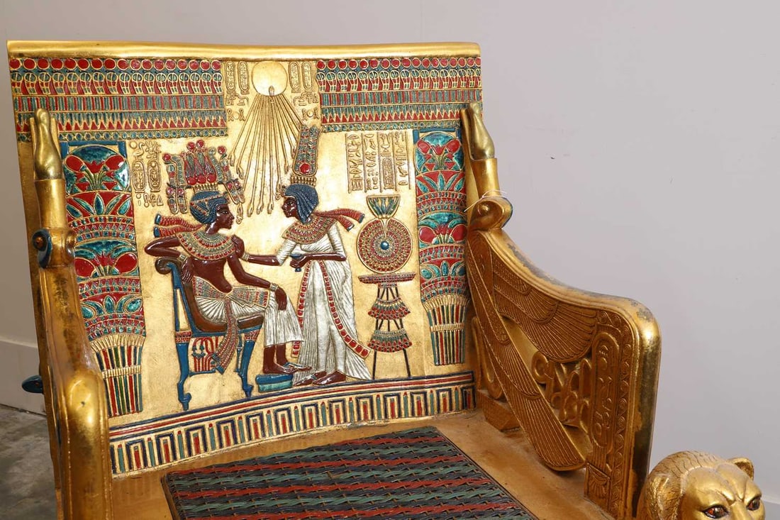 An Egyptian Revival style giltwood armchair, 20th century, - 2