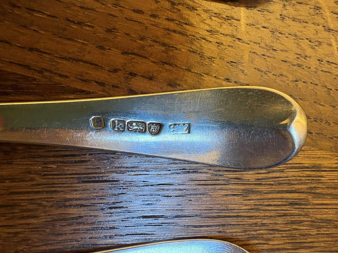 A set of three silver spoons, - 10