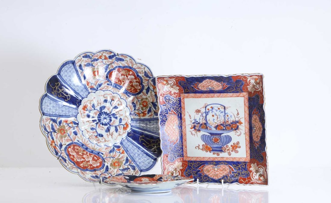 A group of Japanese Imari plates, 19th century,: A group of Japanese Imari plates, 19th century, consisting of one larger round plate, one square plate, and one four sided clover form example, all with foliate decoration 33cm diameter3