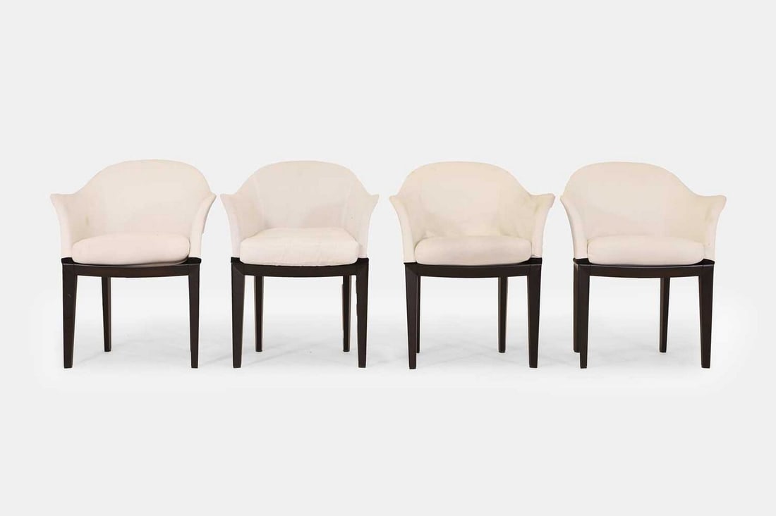 A set of four upholstered dining chairs by Massimo Scolari for Giorgetti, of recent manufacture,: A set of four upholstered dining chairs by Massimo Scolari for Giorgetti, of recent manufacture, Italian, each with a curved back and upholstered cushion, raised on tapering supports (70cm wide, 70cm
