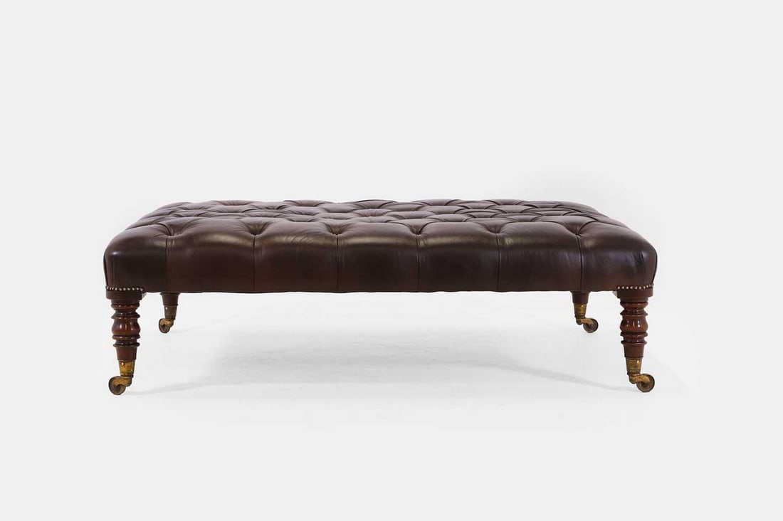 A large buttoned-leather stool or bench, of recent manufacture but incorporating some earlier (1 of 4)