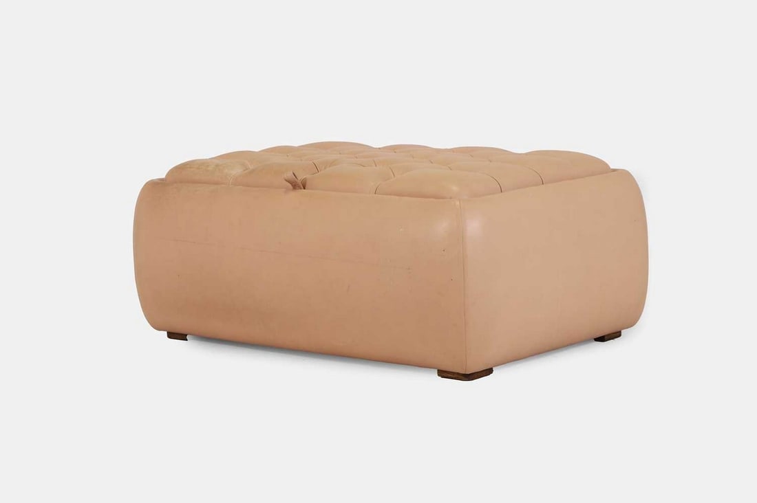 A buttoned leather ottoman, of recent manufacture, (1 of 5)