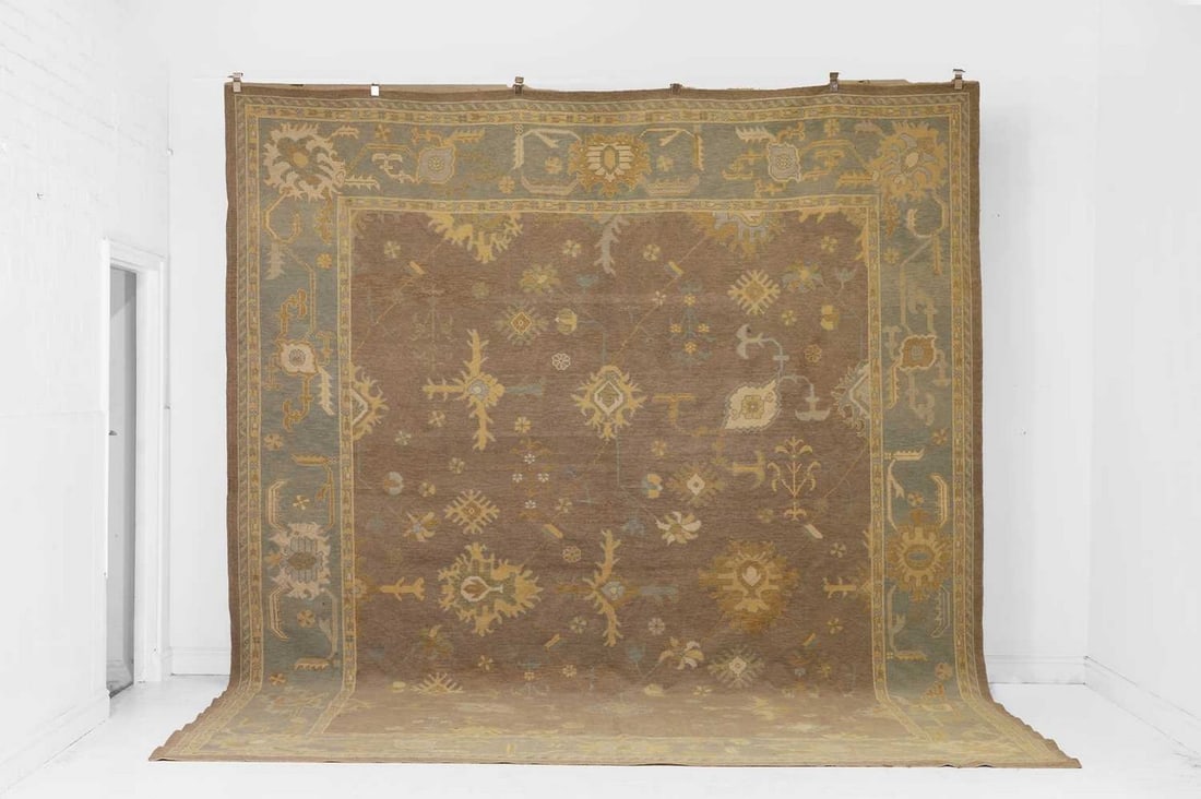 An Oushak wool carpet, of recent manufacture, (1 of 6)