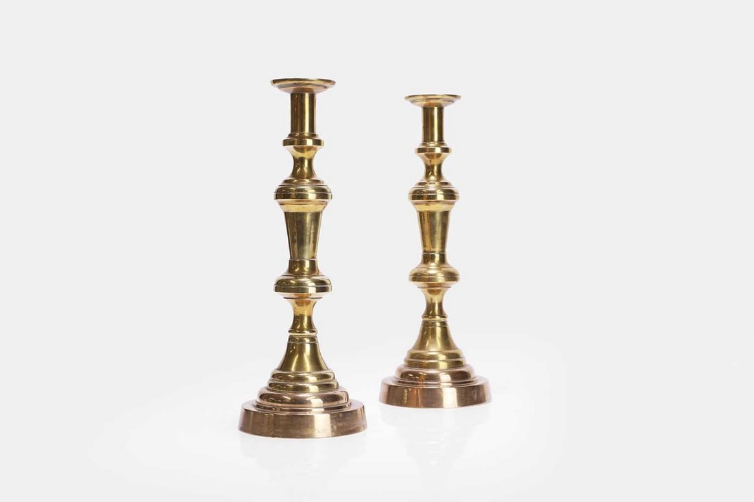 A pair of turned brass candlesticks, late 19th/early 20th century, (1 of 3)