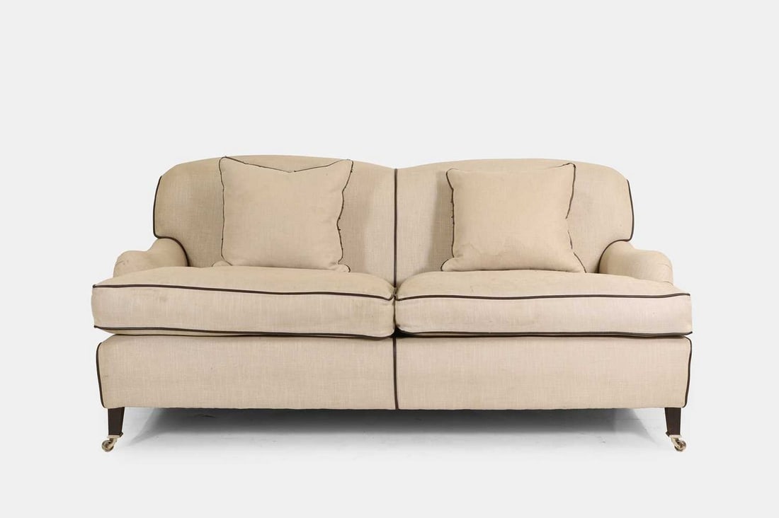 An upholstered two-seater sofa in the Howard & Sons style, of recent manufacture, (1 of 3)