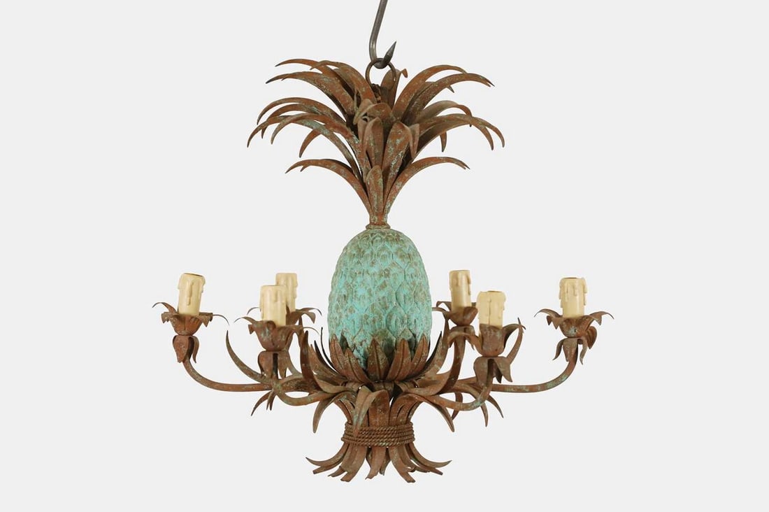 A Hollywood Regency oxidised and painted metal chandelier, first quarter of the 20th century,: A Hollywood Regency oxidised and painted metal chandelier, first quarter of the 20th century, French, in the form of a pineapple with abundant foliate decoration and six light branches (61cm diameter,
