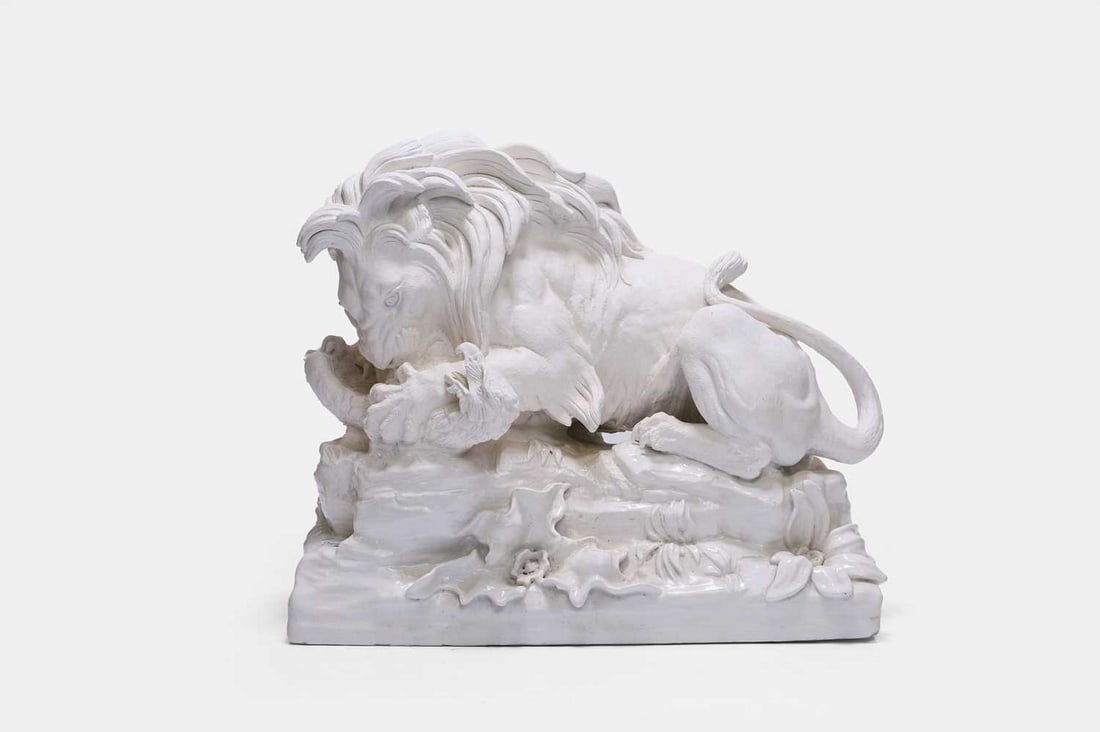 A white-glazed pottery lion, 20th century, (1 of 3)