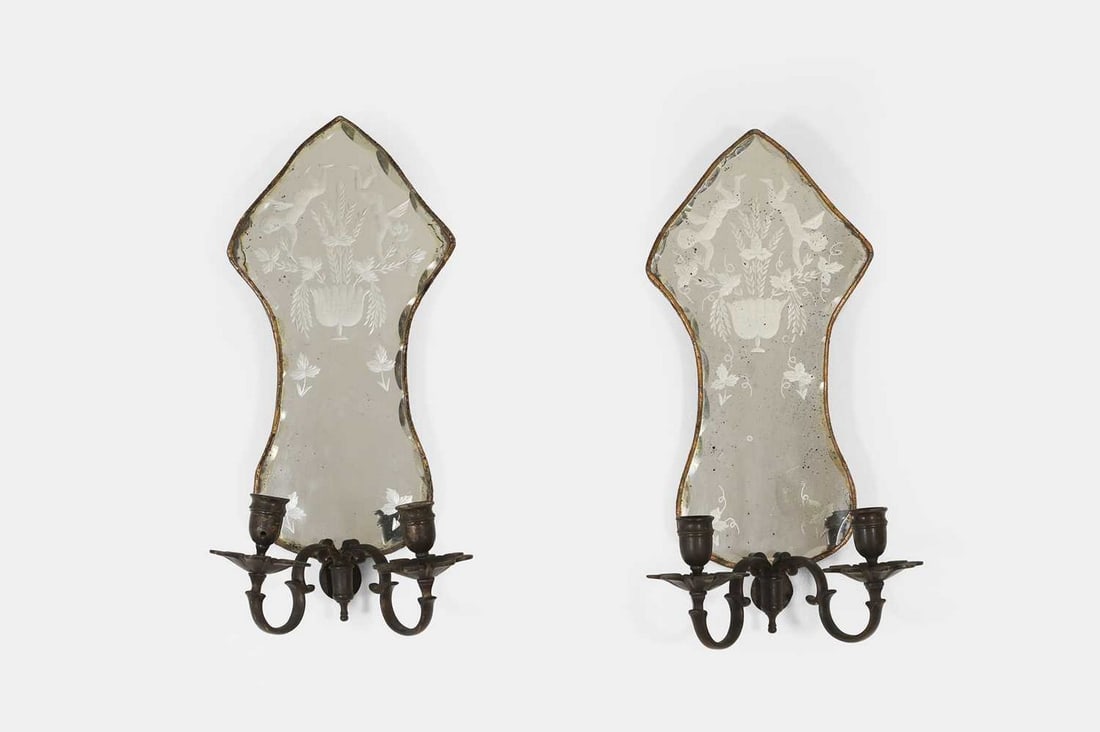 A pair of etched-glass and gilt-metal girandoles, 19th century, Continental,: A pair of etched-glass and gilt-metal girandoles, 19th century, Continental, each with a shaped mirror back depicting a flowering vase flanked by putti, the plate with a scalloped and bevelled edge an