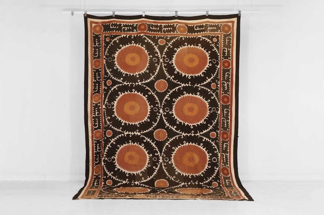 A large suzani, early 20th century, Uzbek, (1 of 5)
