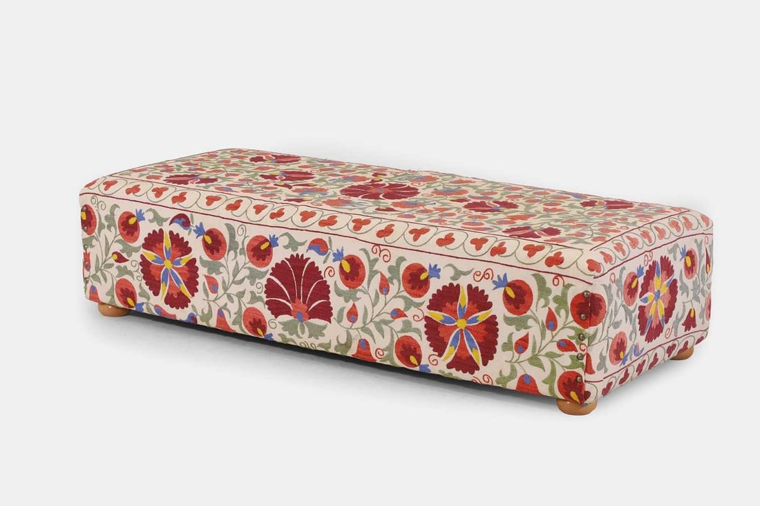 An upholstered ottoman, of recent manufacture, (1 of 4)