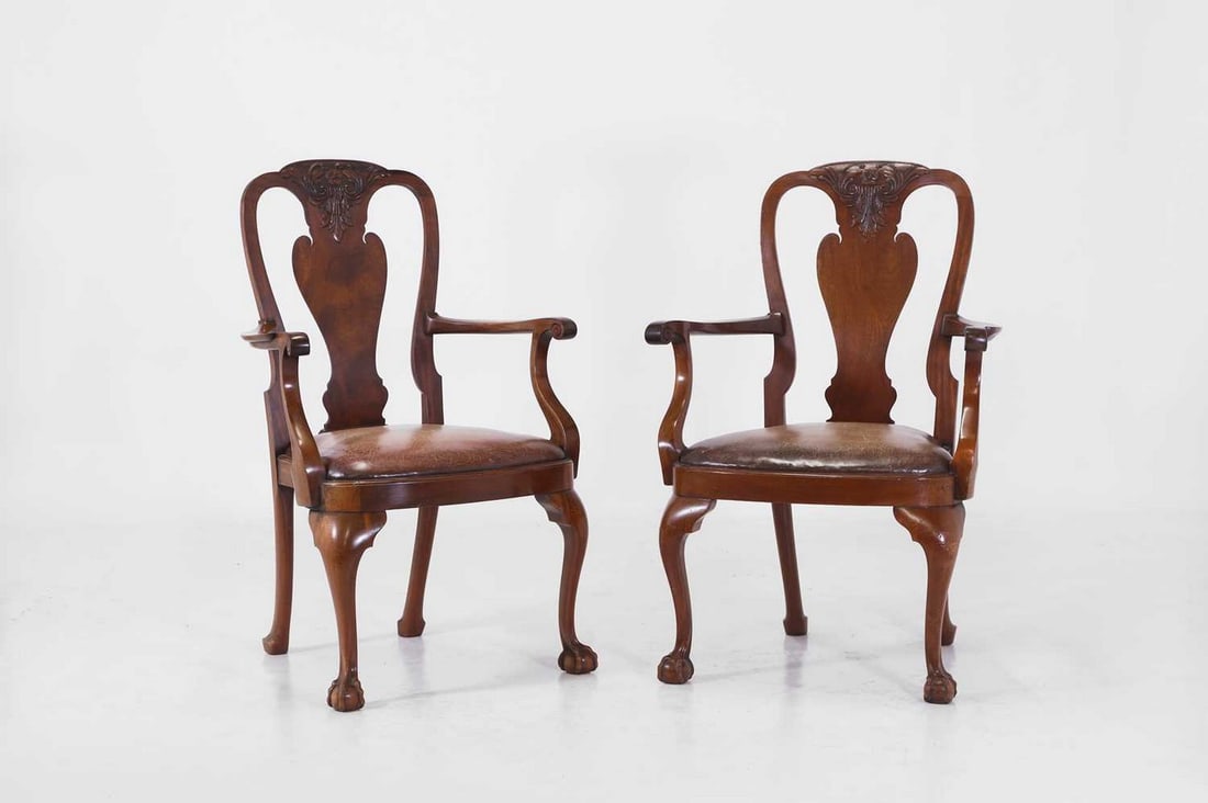 A pair of George II-style mahogany and leather elbow chairs, 20th century, (1 of 3)