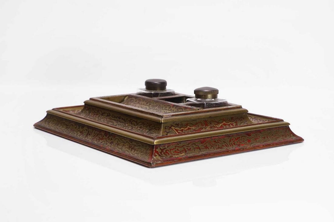 A tortoiseshell and brass desk stand, 19th century, French, in the manner of André-Charles: A tortoiseshell and brass desk stand, 19th century, French, in the manner of André-Charles Boulle, of rectangular form with concave moulded edges, fitted with a pen dish and a pair of glass inkwe