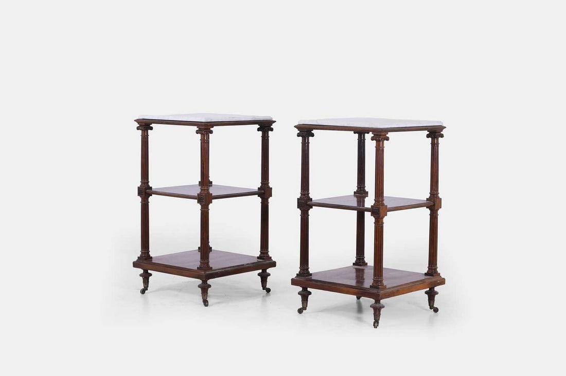 A pair of neoclassical rosewood and marble étagères, mid-19th century,: A pair of neoclassical rosewood and marble étagères, mid-19th century, each with a square top above two shelves, set between fluted Ionic column supports, raised on ring-turned supports term