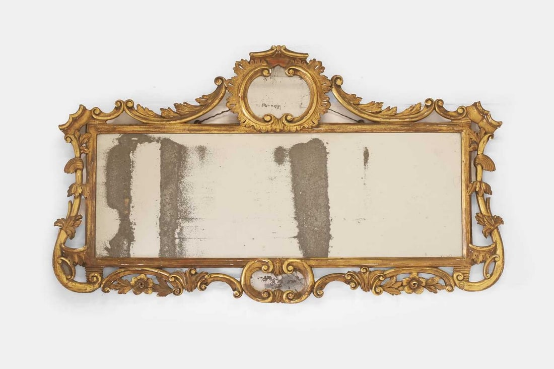 A rococo carved giltwood overmantel mirror, second half of the 18th century, (1 of 2)