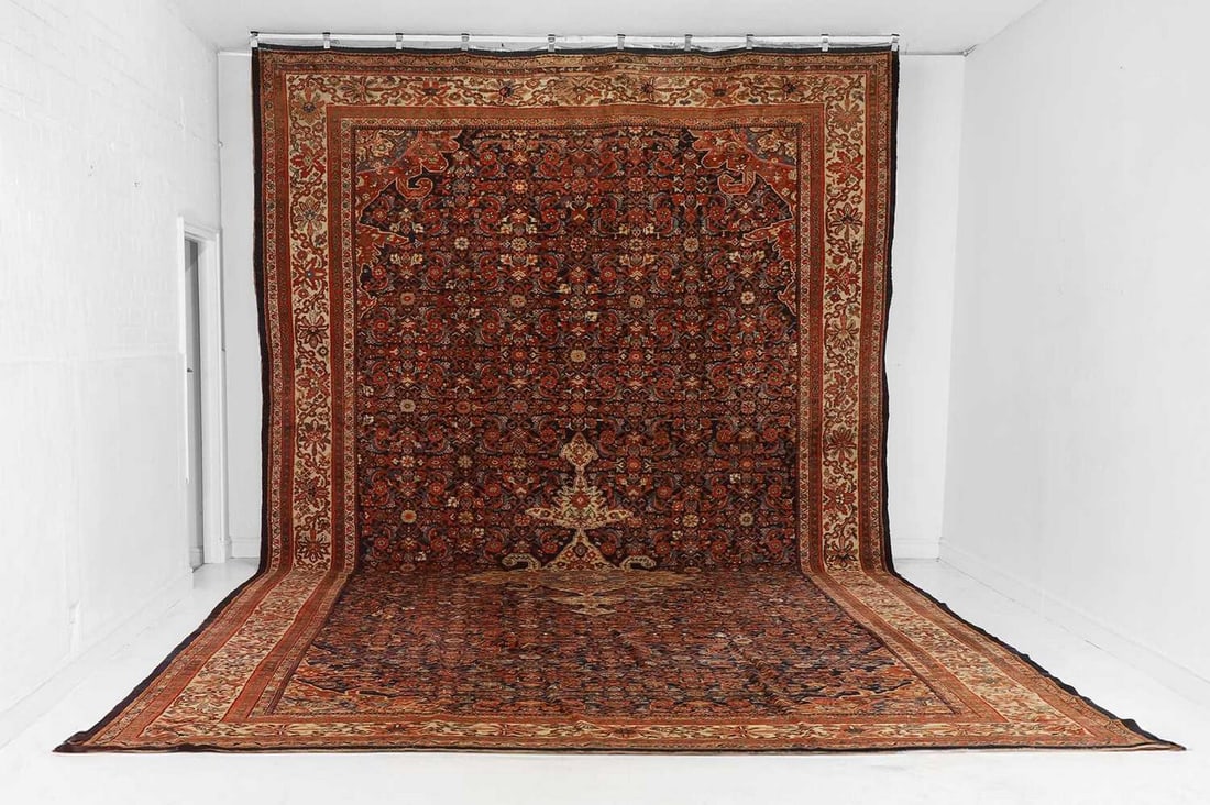 A large Persian Feraghan wool carpet, first half of the 20th century, (1 of 7)